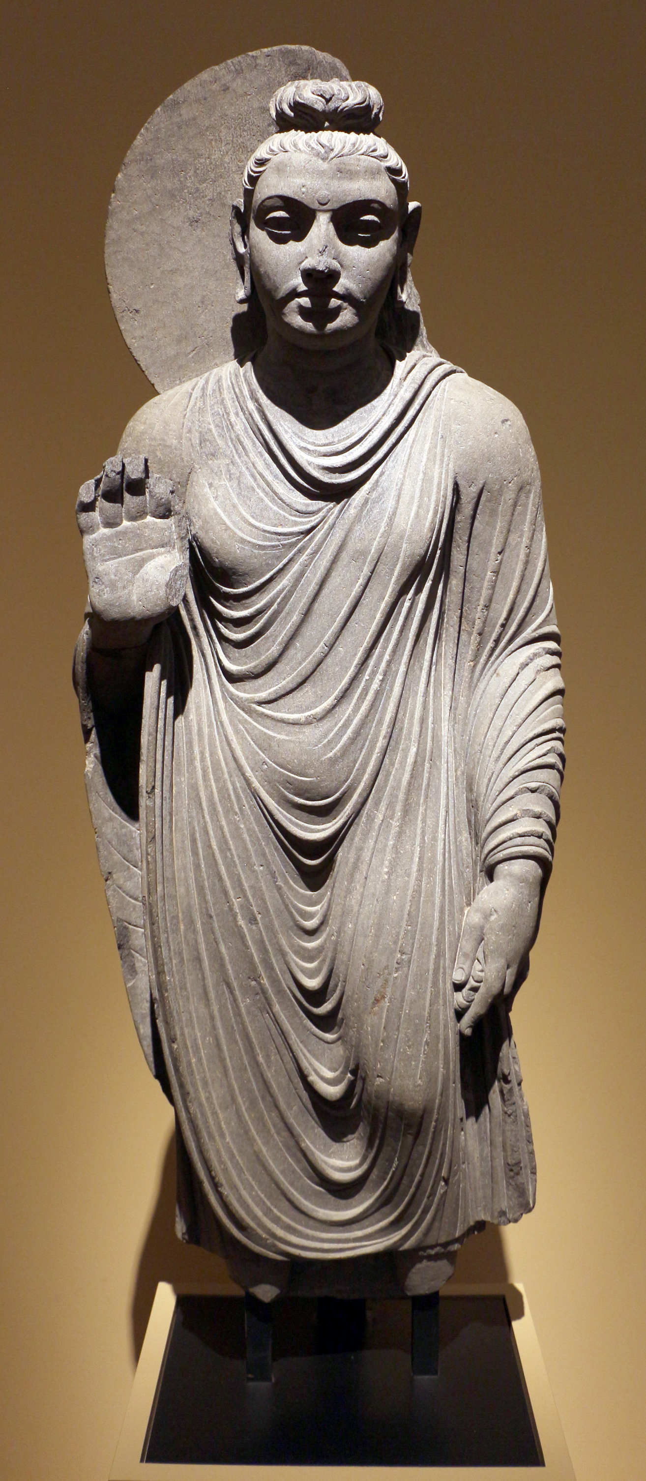 Figure 1: The Buddha in the standing posture, showing the abhayamudrā, 150–200 CE, Gandhāra.